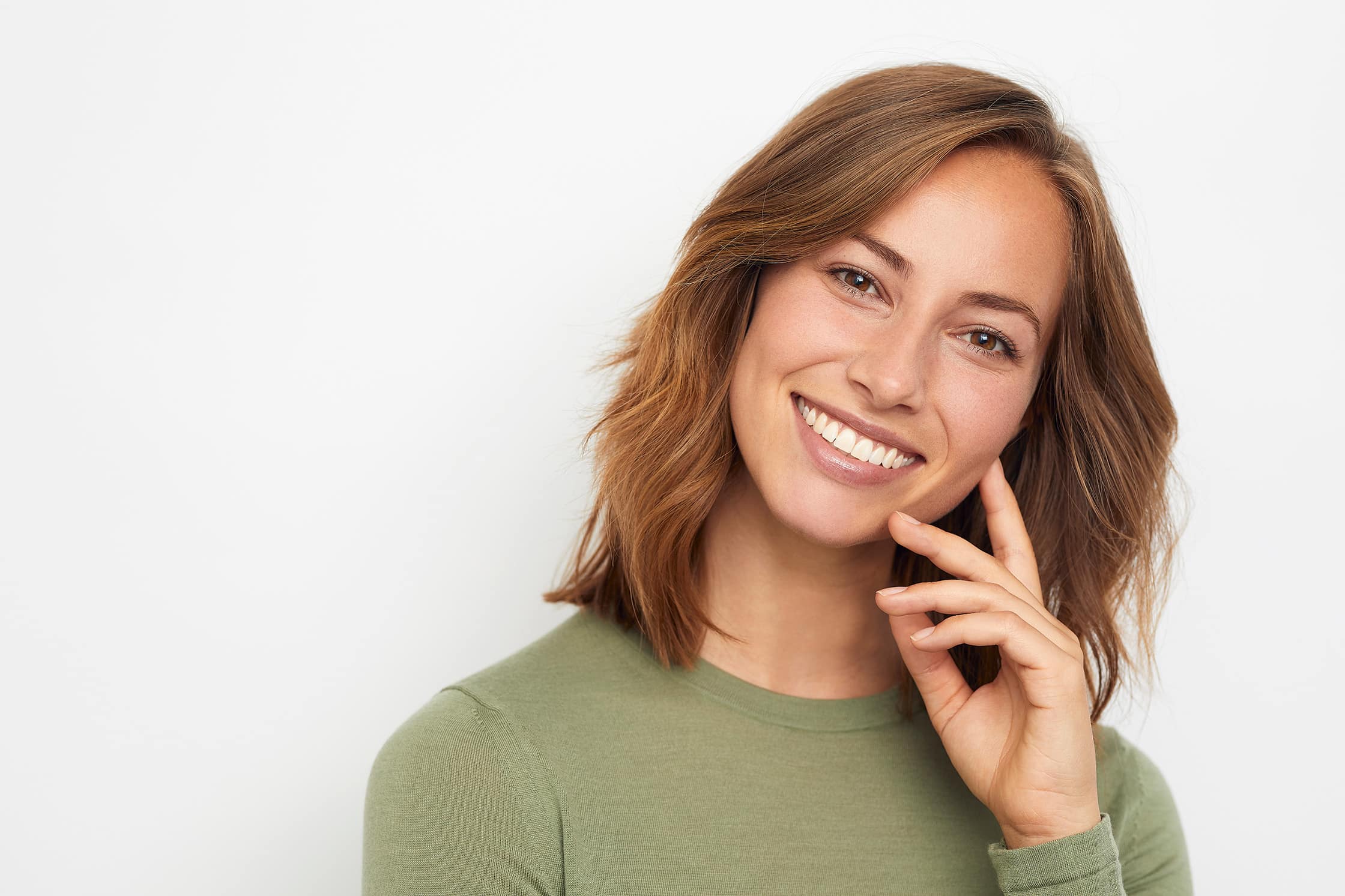 woman smiling, dental crowns at Magnolia Dental Group