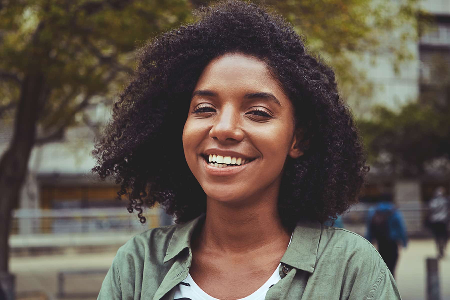 Woman smiling after getting composite dental bonding in Murfreesboro, TN