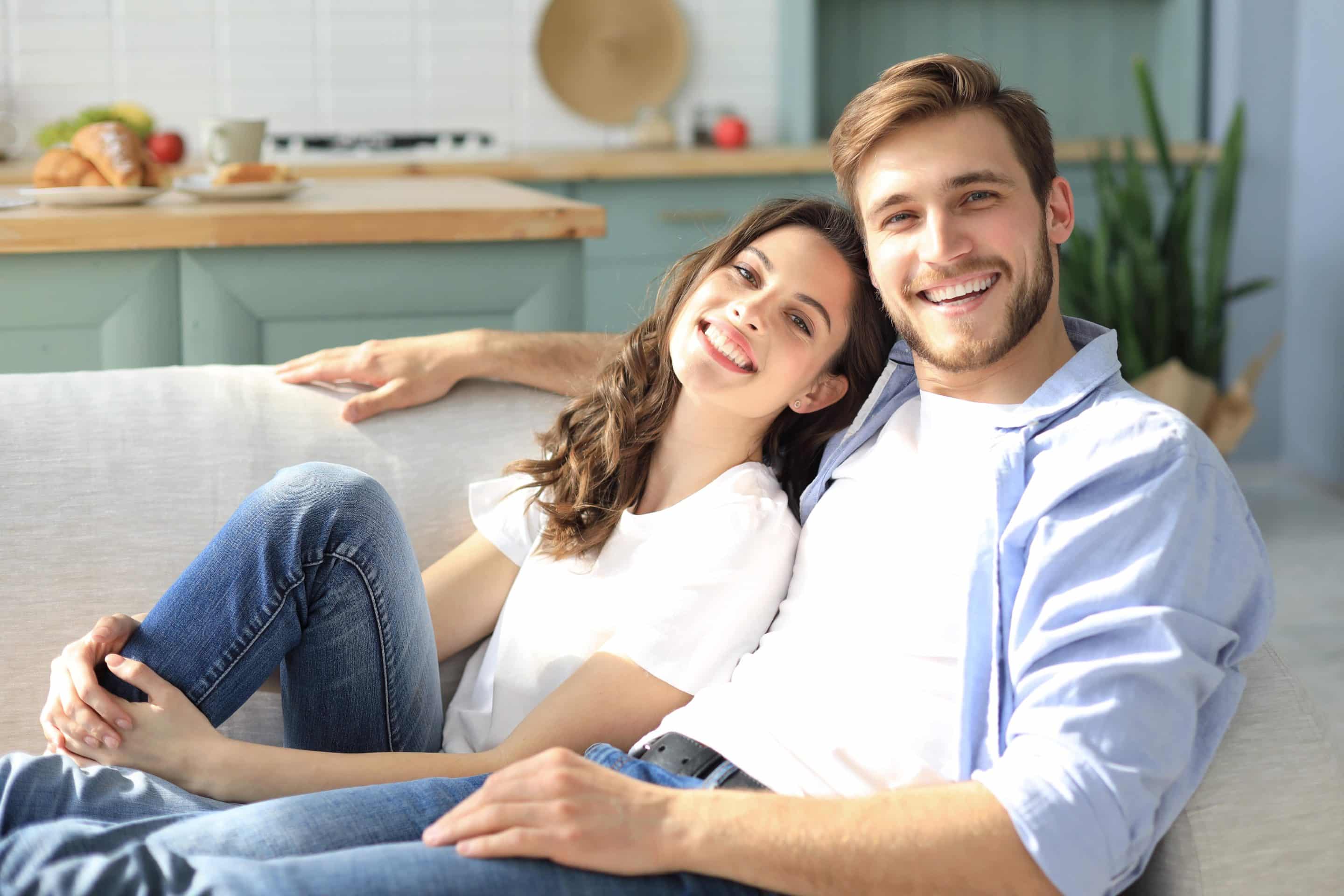 Happy couple showing off their confident smiles after teeth whitening treatment in Murfreesboro TN